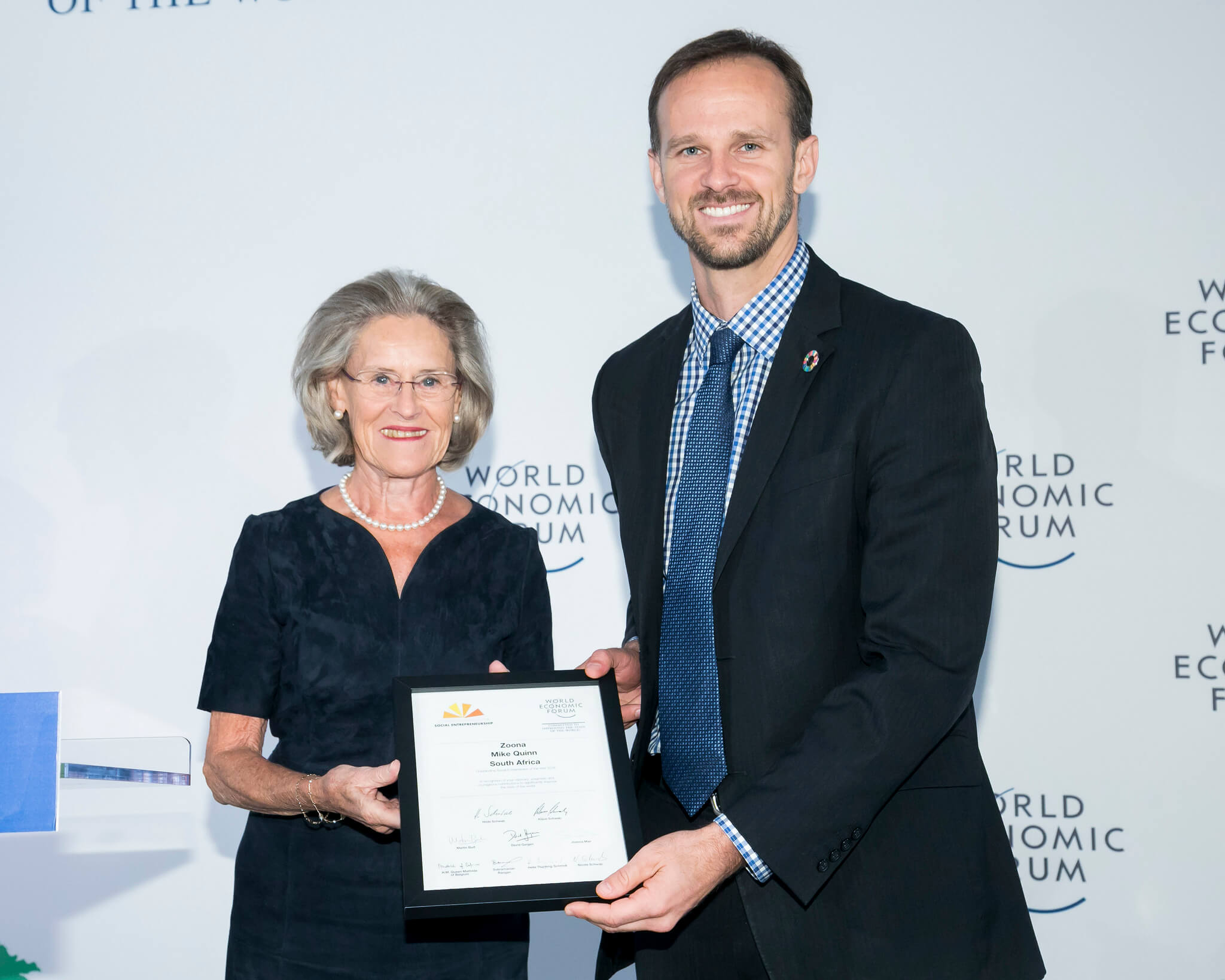 Mike Quinn receives Social Entrepreneur of the Year Award from Hilde Schwab
