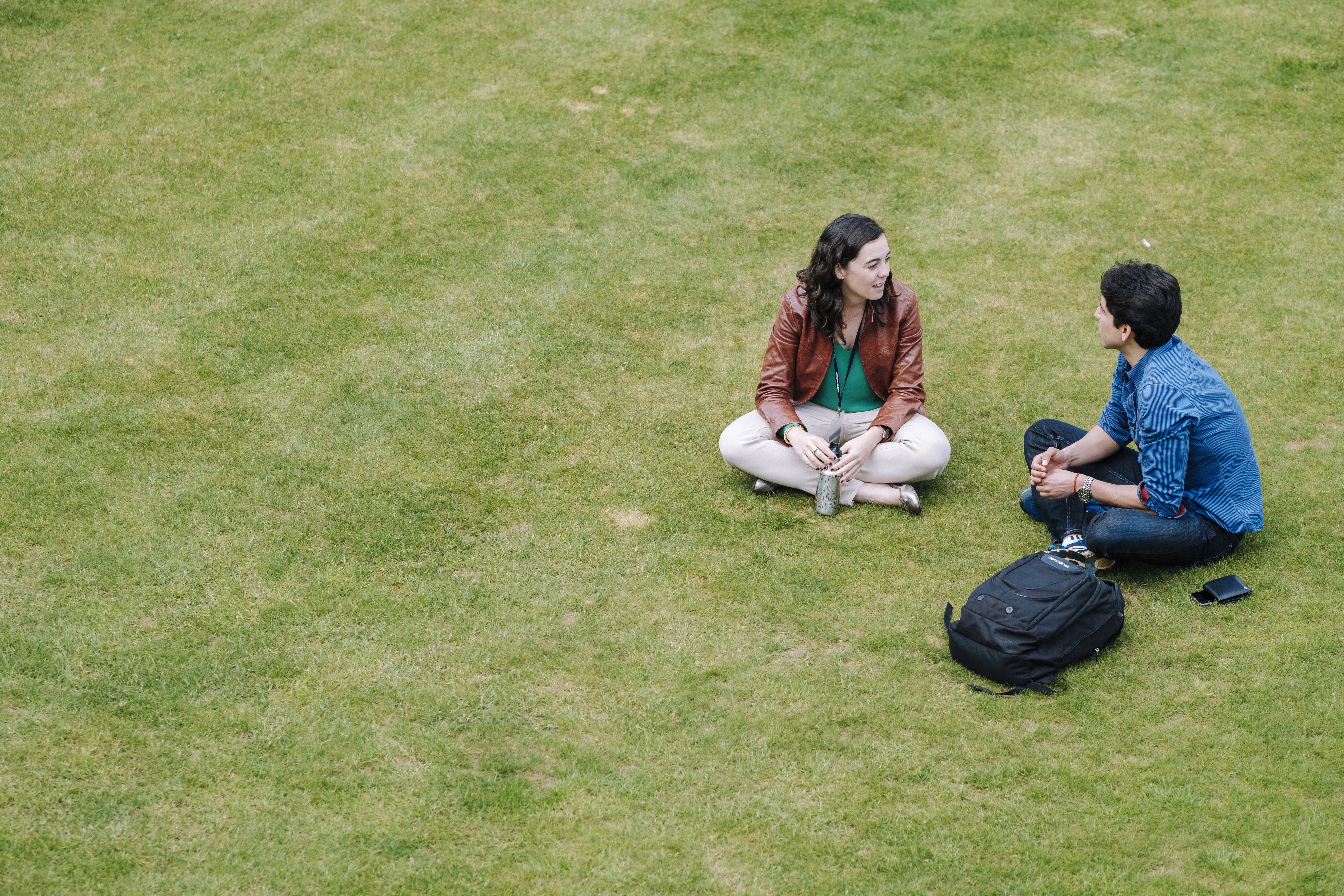 Students relaxing on grass