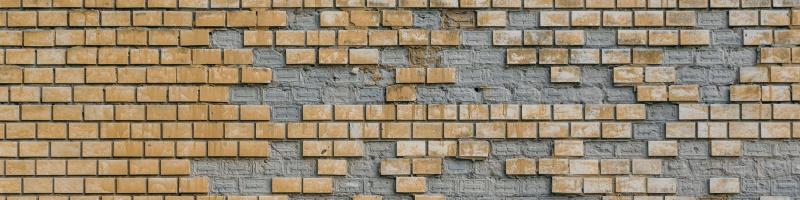 brick wall with bricks missing