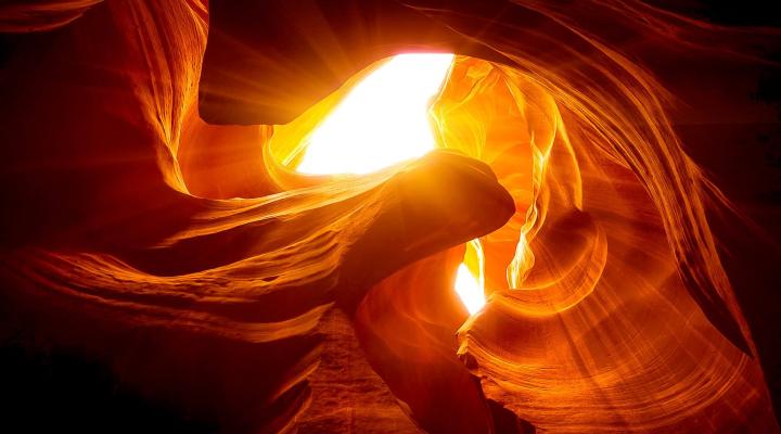 Photograph of the sun through a canyon